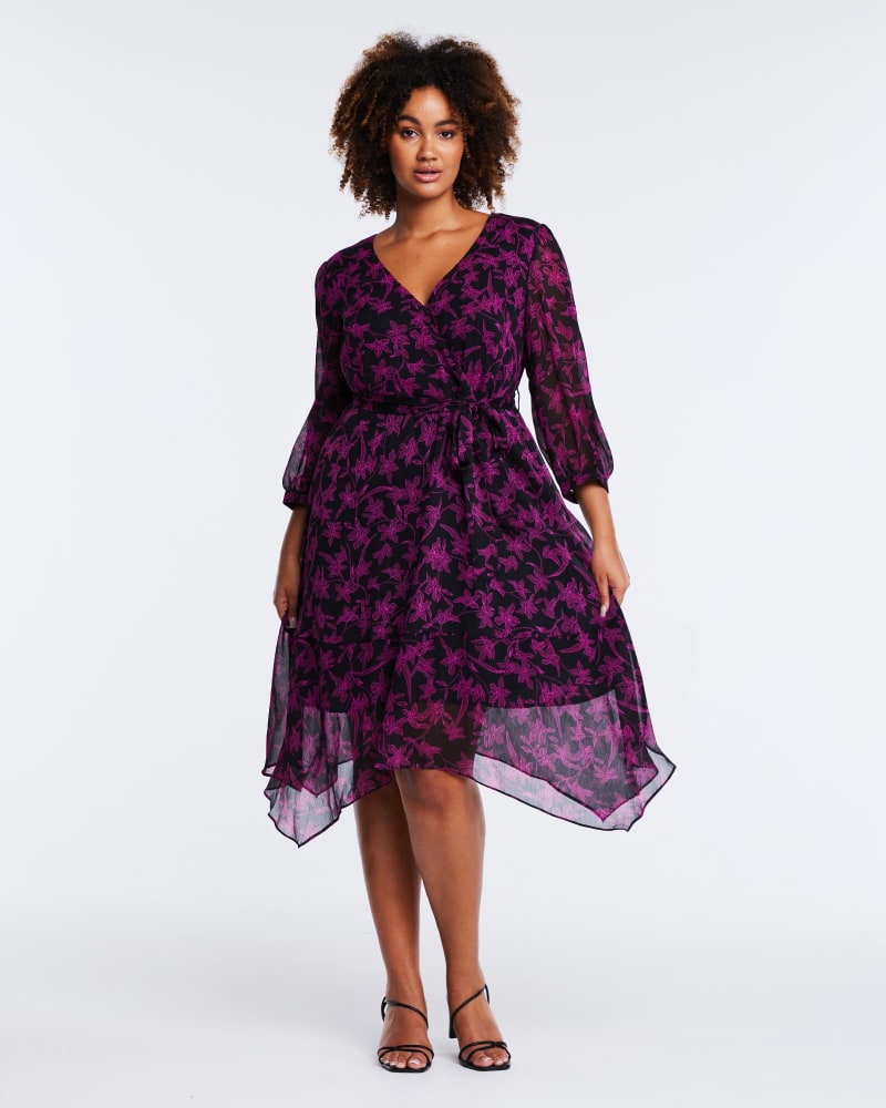 Front of a model wearing a size 24W Boysenberry Bloom Dress in Magenta/Black by Estelle. | dia_product_style_image_id:315555